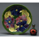 A Moorcroft miniature Anemone vase and Clematis plate, c1975, vase 90mm h, impressed and painted