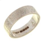 An 18ct white gold ring, bark textured, London 1968, 6.2g, size N Slight wear