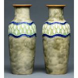 A pair of Doulton Ware vases, c1914-24, decorated in relief with a wavy band, 30cm h, impressed