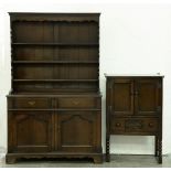 An oak dresser, with boarded rack, the base fitted two drawers above ogee panelled doors, 196cm h;