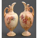 Two Royal Worcester ewers, c1910, printed and painted with wild flowers on a shaded apricot