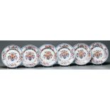 A set of six Chinese Imari plates, late 18th c, decorated to the centre with flowers in panelled