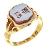 A Victorian gold signet ring, the shield shaped agate intaglio with claw shoulders, the underside