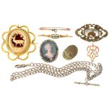 A paste locket, an Egyptian faience scarab amulet, a Victorian carved bone and giltmetal brooch, a