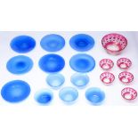 A set of five semi opaque blue glass finger bowls and seven plates, c1930, plates 20cm diam and a