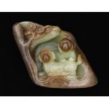 A Chinese jade pebble carving of two dogs in a cave, 90mm h Good condition
