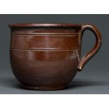 A Derbyshire saltglazed brown stoneware handled pot or porringer, Brampton or Chesterfield, late
