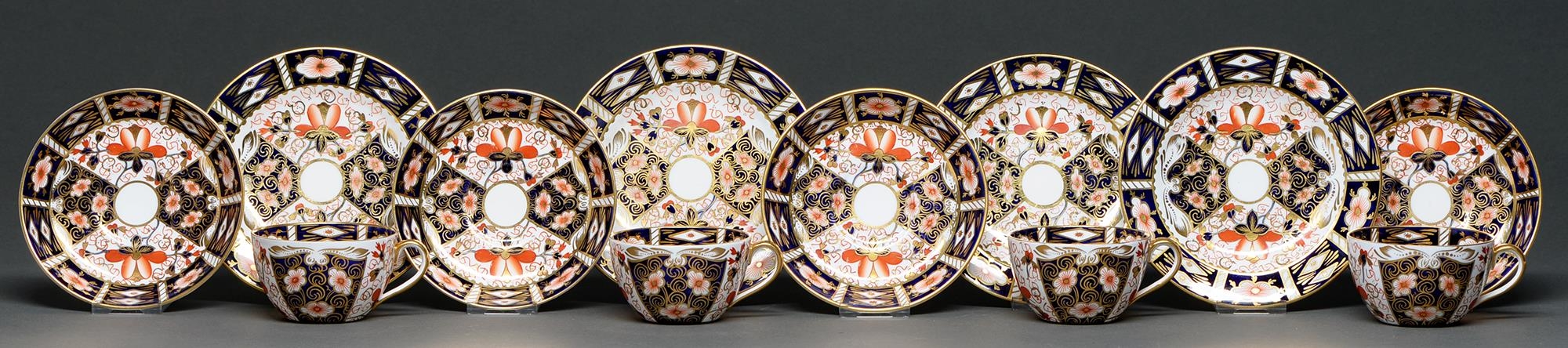 A set of four Royal Crown Derby Old Derby Witches pattern teacups, saucers and side plates, 1924 and