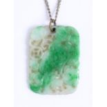 A Chinese jadeite pendant, carved, pierced and engraved with foliage and shou, 35 x 25mm