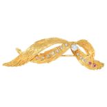 A French ruby and diamond brooch,  c1960, of entwined leafy ribbon design, 63mm l, lozenge shaped