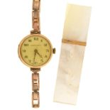 A Tavannes 9ct gold lady's wristwatch, 26mm diam, import marked London 1924, on a gold coloured