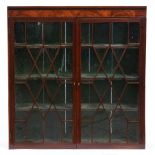 A Victorian mahogany bookcase, with lappet glazed door, originally a fitment, 127cm h; 33 x 120cm