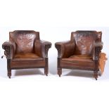 A pair of close nailed brown hide and carved oak armchairs, c1930, seat depth 68cm Condition evident