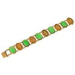 A Chinese jade and gold bracelet, first half 20th c, the five oval jade cabochons alternating with