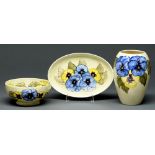 A Moorcroft Pansy Nouveau vase, bowl and dish, 1972-73, vase 17.5cm h, impressed marks and painted