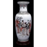 A Chinese porcelain vase, intricately enamelled in black and red with immortals and attendants,
