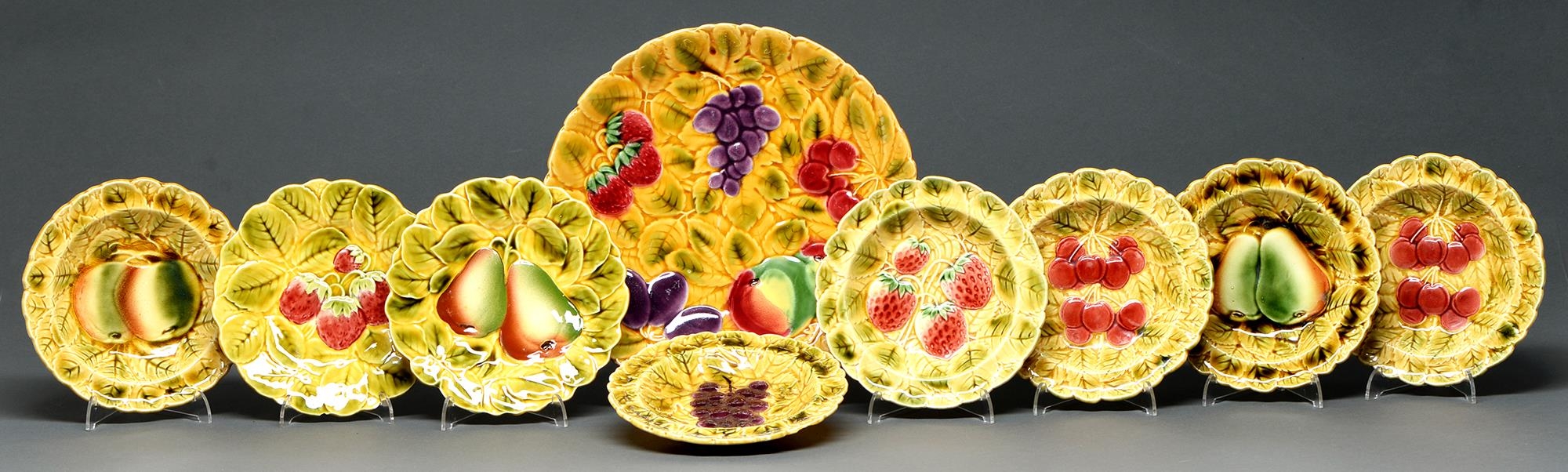 A Sarreguemines majolica dessert service, early 20th c, moulded with fruit, dish 30cm diam,