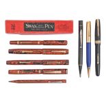 Three Mabie, Todd & Co Ltd "Swan" and Burnham fountain pens, in marbled sealing wax red, each with
