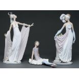 Three Lladro figures of young women, 34cm h and smaller, printed mark The hand of the figure with