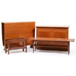 An English mid-century modern teak coffee table, dropleaf table, two door cupboard and a