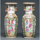 Two Canton famille rose vases, 19th c, with gilt handles and applied around the shoulder with