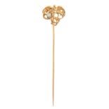 A Belle Epoque gold stickpin,  French, c1900, the terminal in the form of an eagle  with  old cut