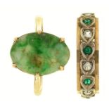 A carved jade ring, in gold marked 9ct and a green and white paste eternity ring in gold marked 9ct,