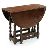 An oak gateleg table, part 18th c, on bobbin underframe, 70cm h; 88 x 106cm Wear, especially to