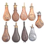 Six Victorian brass mounted copper powder flasks and three other contemporary metal or leather
