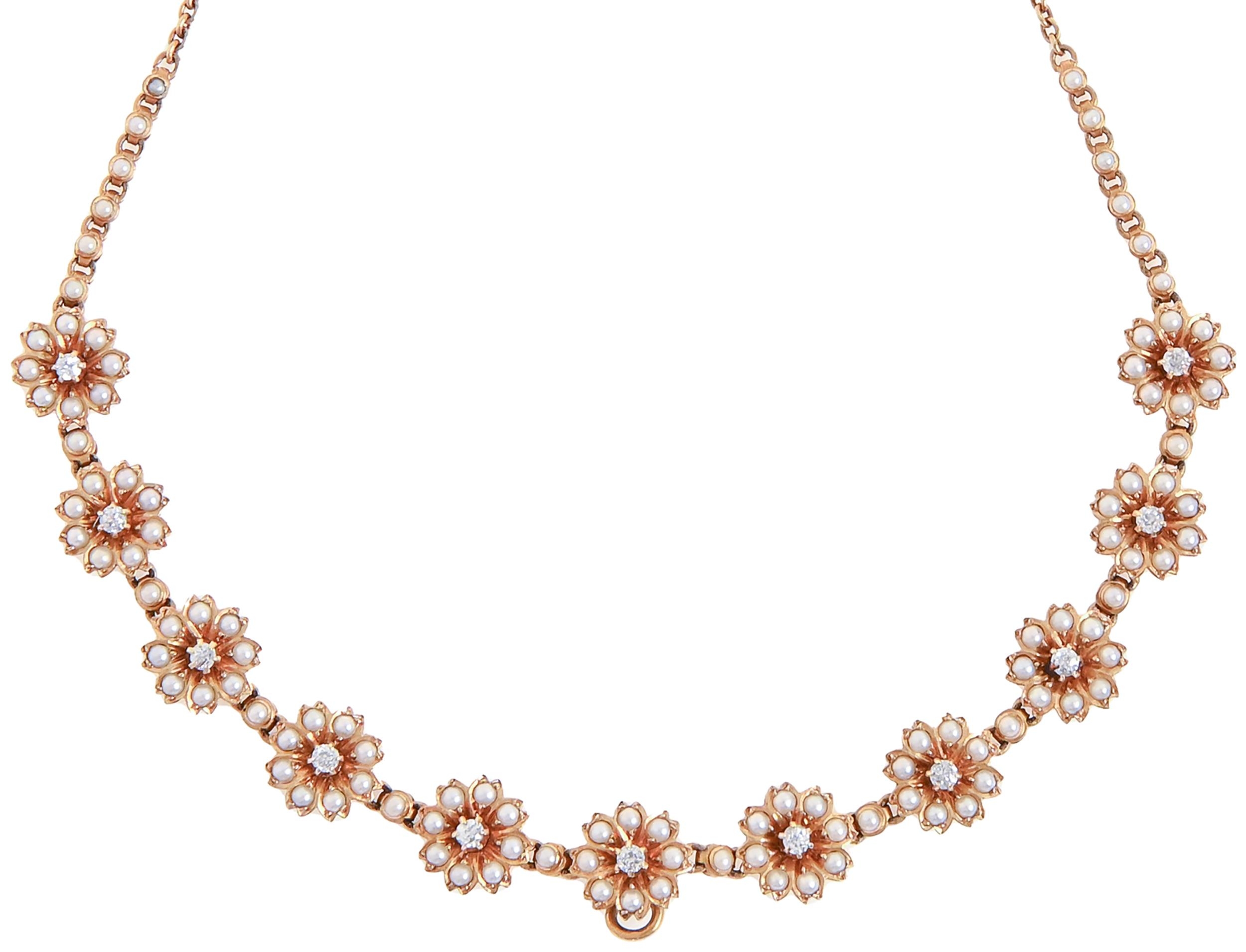 A diamond and split pearl necklet, early 20th c, the eleven flower clusters divided by single