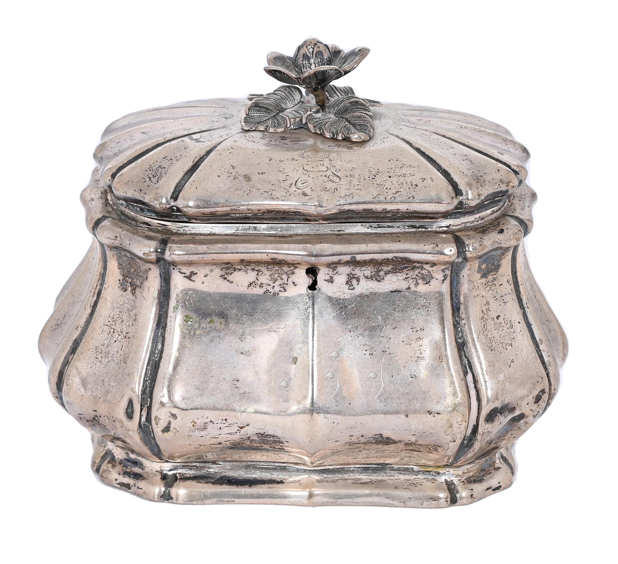 A Continental silver tea caddy, probably German, c1880, of bombe form with naturalistic flower knop,