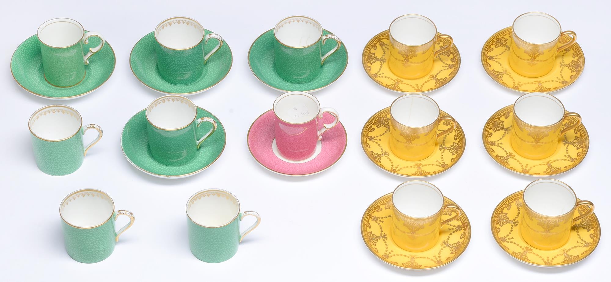 A set of six Aynsley yellow ground coffee cans or saucers, early 20th c, decorated with gilt