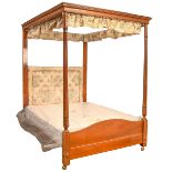 A mahogany and line inlaid four-poster bed, early 20th c, with dentil tester and reeded, leaf carved