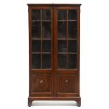 A oak bookcase, early 20th c, the glazed doors with lower panels, on bracket feet, 154cm h; 27 x