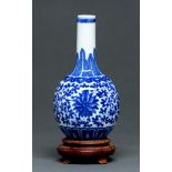 A Chinese blue and white bottle shaped vase, late 19th / early 20th c, painted with lotus meander,