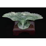 A Chinese jade carving of an eagle, wingspan 25cm, wood stand Good condition