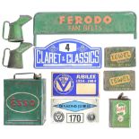 Vintage motoring. An Esso petrol can, a green and orange painted metal point of sale nameboard