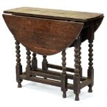 A George II oak gateleg table, with bobbin turned legs, 75cm h; 92 x 97cm Top unevenly stained and