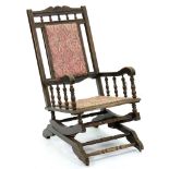 A North American stained beech American rocking chair, early 20th c Wear to arms