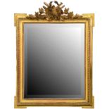 A giltwood mirror, early 20th c,  the bevelled plate in rectangular ribbon and reed frame with