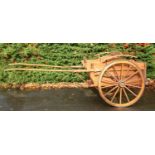 Horse drawn vehicle. A   trap, with elm body, the back with doors, leaf spring suspension,  spoked