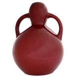 Art pottery. A Burmantofts red glazed double gourd vase, 1882-c1900, 35cm h, impressed monogram,