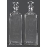 Royal. A pair of English glass spirit decanters and stoppers, possibly James Powell & Sons'