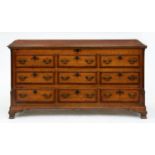 A George III oak and crossbanded Lancashire chest,  with fluted pilasters,  on ogee feet, 85cm h, 54