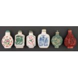 Five Chinese famille rose and blue and white snuff bottles and a cinnabar lacquer example, 20th