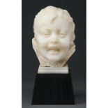A statuary marble sculpture of the head of a smiling child, 19th / early 20th c, on pyramidal