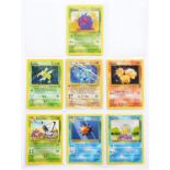 Seven Pokémon cards, including Machamp hologram, loosely-inserted in a collector's sleeve, [1]