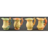 Four Burgess and Leigh Burleigh ware parrot or squirrel handled yellow jugs, 1930's, 20cm h, printed