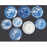 Miscellaneous English blue printed earthenware plates, dishes, a tureen and an egg frame, early 19th