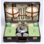 An early-mid 20th century motoring picnic case, by Sirram, four-setting, including flatware, ceramic